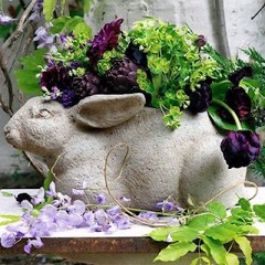 Adorable bunny planter filled and surroundes with Easter florals